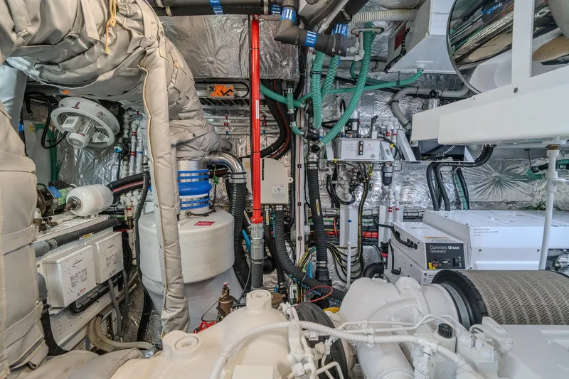 Ramaya 4 Yacht Photos Pics Engine room of 2023 Sunseeker 88 Yacht, showcasing complex machinery and wiring.
