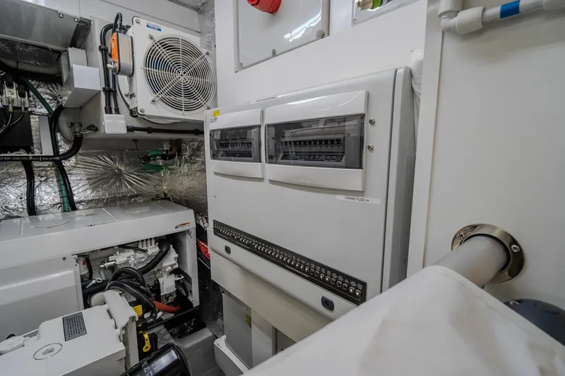 Ramaya 4 Yacht Photos Pics Engine room of 2023 Sunseeker 88 Yacht, featuring electrical panels and machinery.