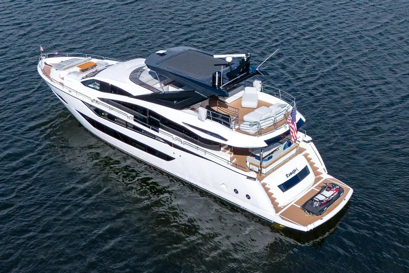 Ramaya 4 Yacht Photos Pics 2023 Sunseeker 88 Yacht cruising on open water, showcasing luxury design and spacious decks.