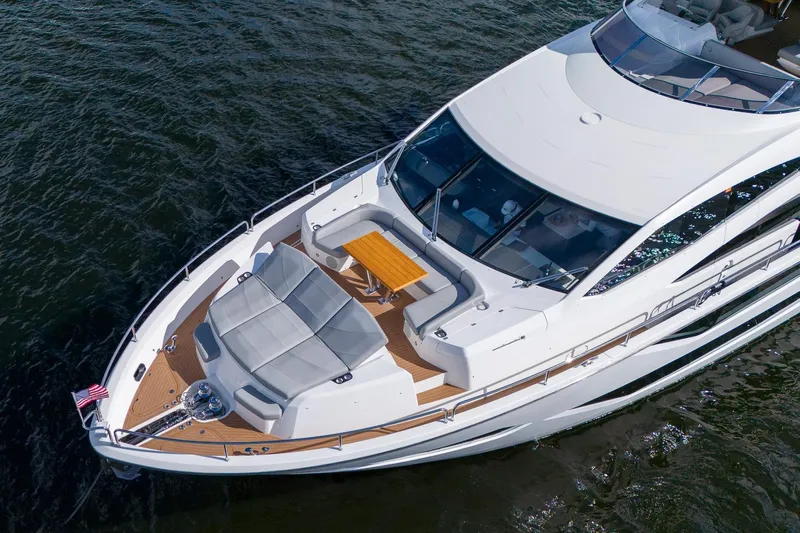 Ramaya 4 Yacht Photos Pics 2023 Sunseeker 88 Yacht, aerial view, luxurious deck seating, cruising on water.