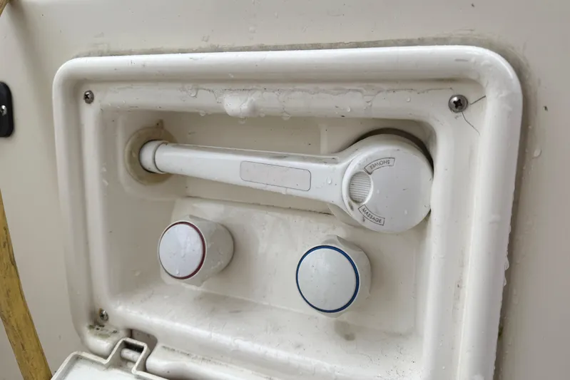Hula Moon Yacht Photos Pics Outdoor shower controls on a 2006 Mainship 34 Trawler boat.