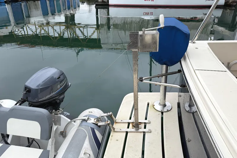 Hula Moon Yacht Photos Pics 2006 Mainship 34 Trawler with Yamaha motor and docked inflatable boat.