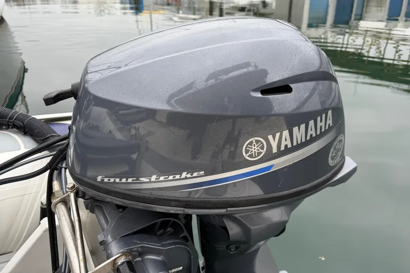 Hula Moon Yacht Photos Pics Yamaha four-stroke outboard motor on a 2006 Mainship 34 Trawler at a marina.