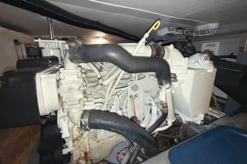 Hula Moon Yacht Photos Pics Engine room of 2006 Mainship 34 Trawler, showcasing detailed mechanical components.