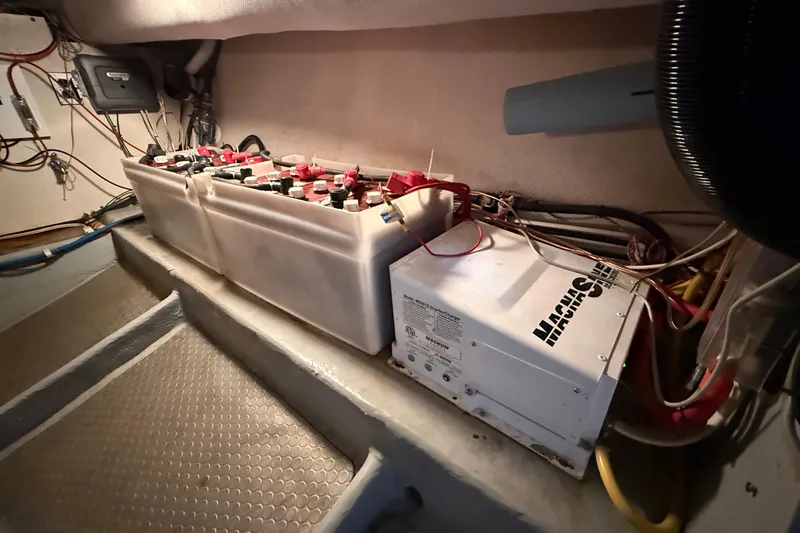 Hula Moon Yacht Photos Pics Engine room of 2006 Mainship 34 Trawler with battery and electrical components.