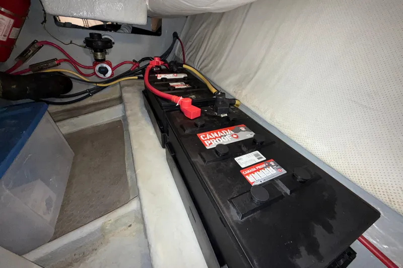 Hula Moon Yacht Photos Pics Battery compartment of 2006 Mainship 34 Trawler with Canada Proof batteries and wiring.