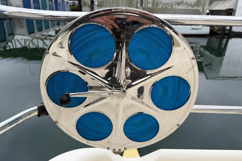 Hula Moon Yacht Photos Pics Close-up of a 2006 Mainship 34 Trawler's nautical instrument with blue rope.