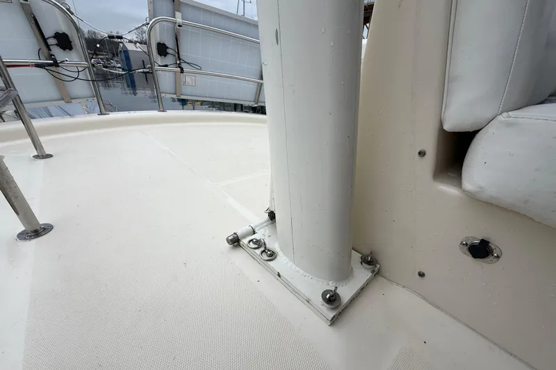 Hula Moon Yacht Photos Pics 2006 Mainship 34 Trawler deck with railing and seating detail.