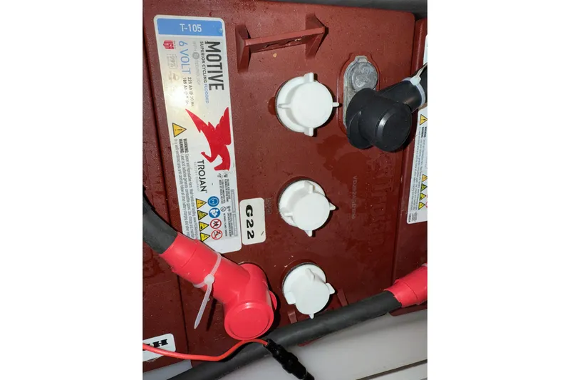 Hula Moon Yacht Photos Pics Battery compartment of a 2006 Mainship 34 Trawler with Trojan T-105 6-volt battery.