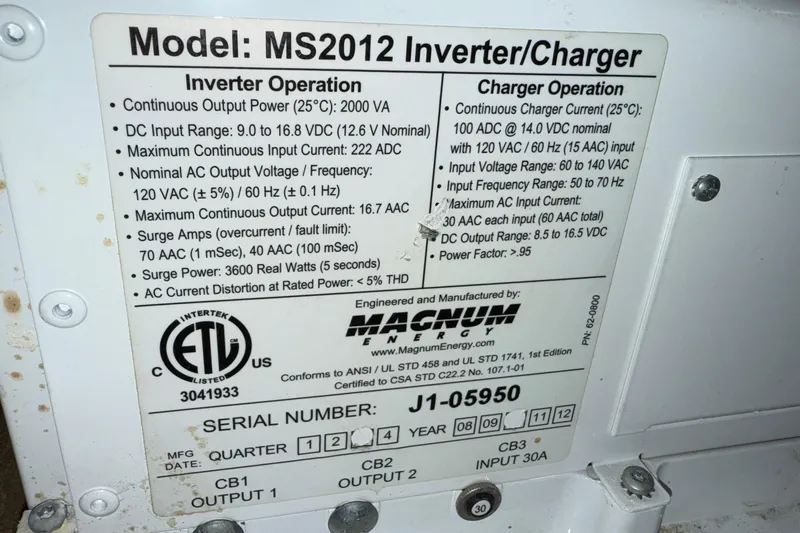 Hula Moon Yacht Photos Pics ```json { "alt_text": "MS2012 Inverter/Charger specifications on Mainship 34 Trawler, 2006 model." } ```