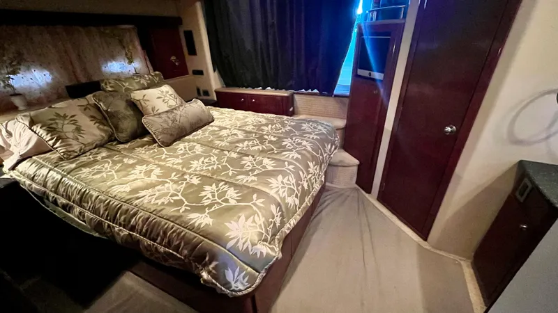  Yacht Photos Pics Luxurious bedroom in 2008 Meridian 459 Motoryacht with elegant bedding and wood accents.