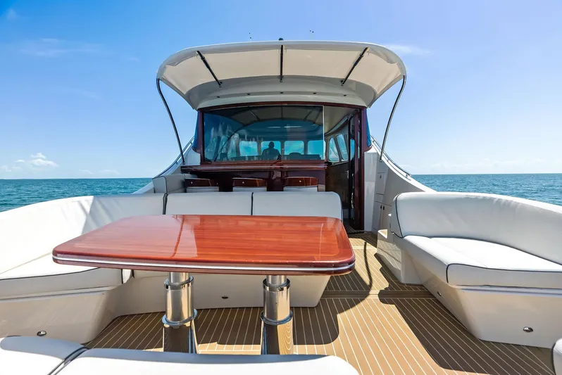 Dutch Yacht Photos Pics Luxurious 2019 Zeelander 55 yacht with elegant seating and wooden table on deck.