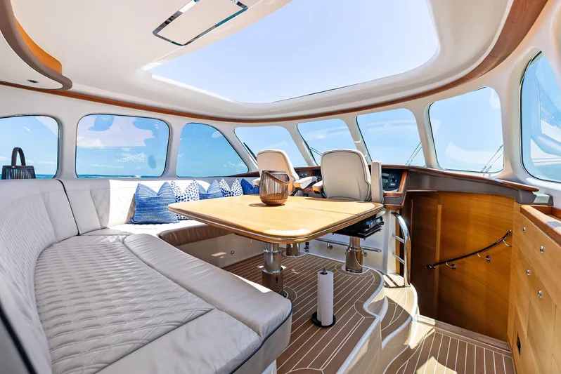 Dutch Yacht Photos Pics Luxurious interior of 2019 Zeelander 55 yacht with elegant seating and panoramic windows.