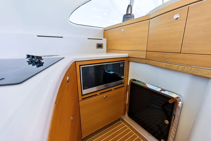 Dutch Yacht Photos Pics Interior of 2019 Zeelander 55 yacht with modern kitchen cabinetry and appliances.