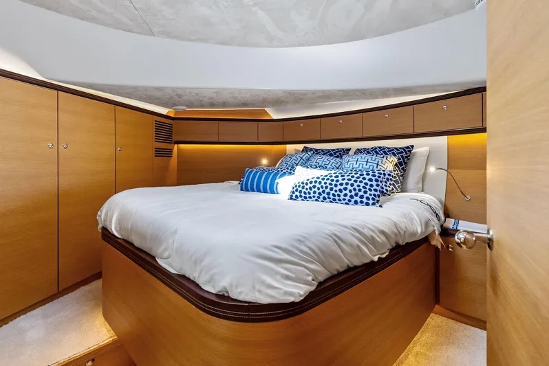 Dutch Yacht Photos Pics Luxurious bedroom interior of 2019 Zeelander 55 yacht with elegant wood finish and cozy bedding.