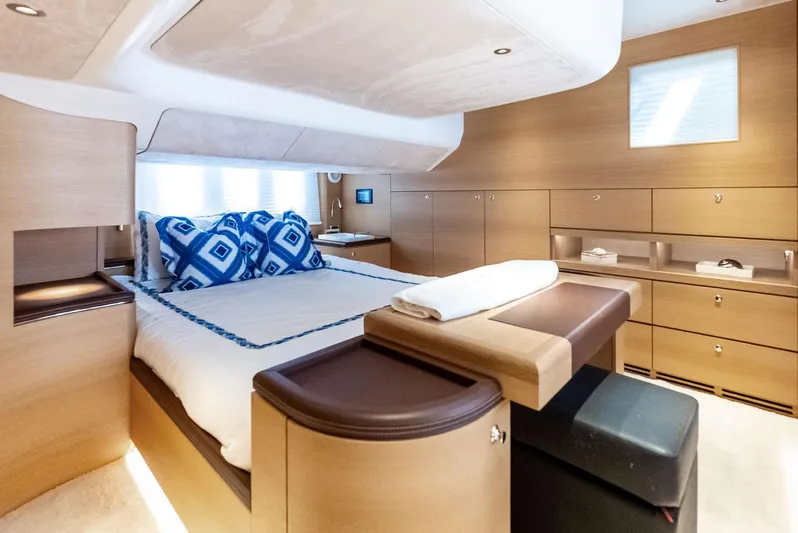 Dutch Yacht Photos Pics Luxurious interior of 2019 Zeelander 55 yacht with elegant wood finish and plush bedding.
