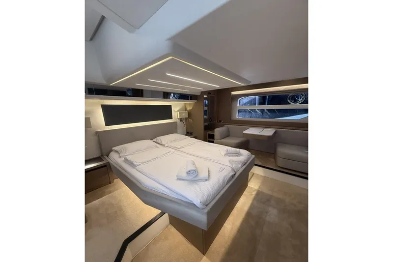  Yacht Photos Pics Luxurious interior of 2022 Prestige 590 yacht with elegant bedroom design.