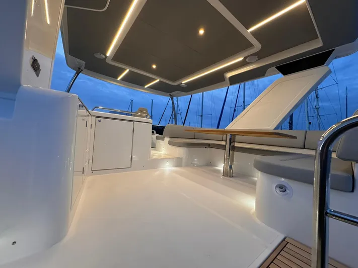  Yacht Photos Pics Luxurious 2024 Absolute 58 Navetta yacht interior with modern lighting and sleek design.