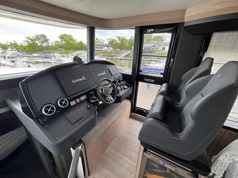  Yacht Photos Pics Helm of 2024 Absolute 58 Navetta yacht with modern controls and dual seating.