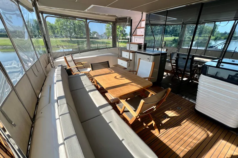  Yacht Photos Pics 2024 Absolute 58 Navetta yacht interior with elegant seating and dining area.