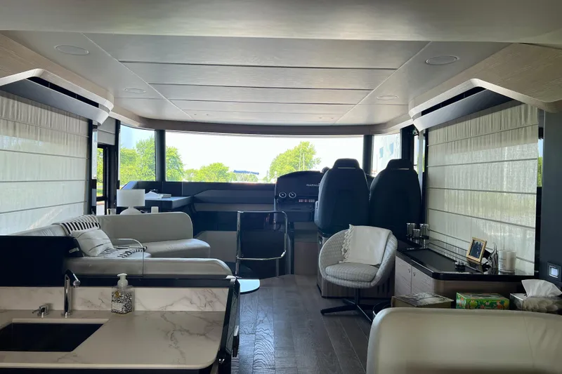  Yacht Photos Pics Luxurious interior of 2024 Absolute 58 Navetta yacht with modern seating and panoramic windows.