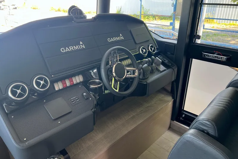  Yacht Photos Pics 2024 Absolute 58 Navetta helm with Garmin navigation displays and modern controls.