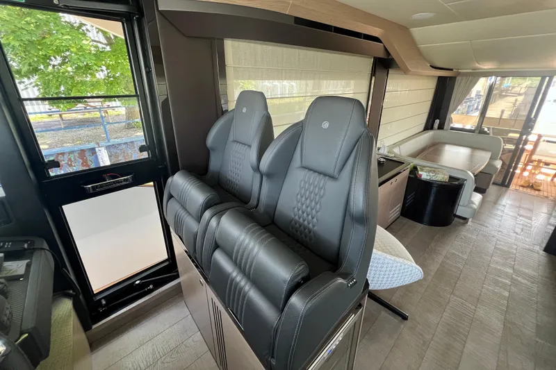  Yacht Photos Pics Luxurious interior of 2024 Absolute 58 Navetta yacht with modern seating and elegant design.