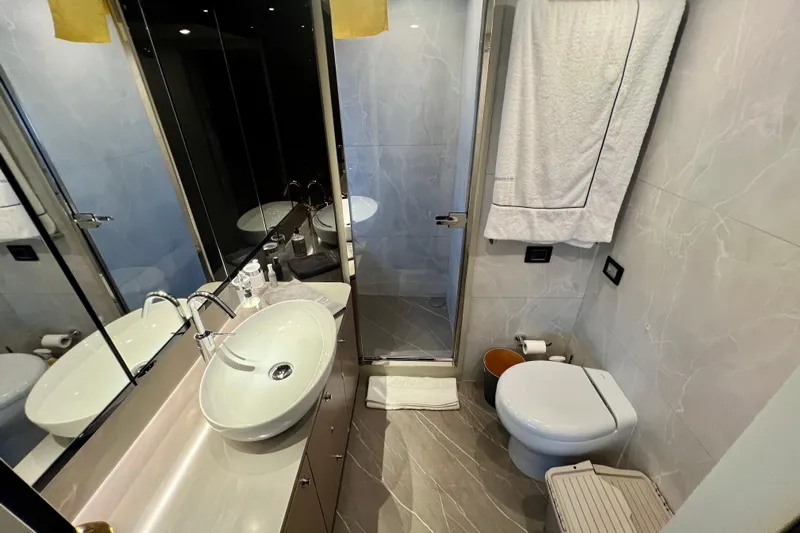  Yacht Photos Pics Luxurious bathroom in 2024 Absolute 58 Navetta yacht with modern fixtures and elegant design.