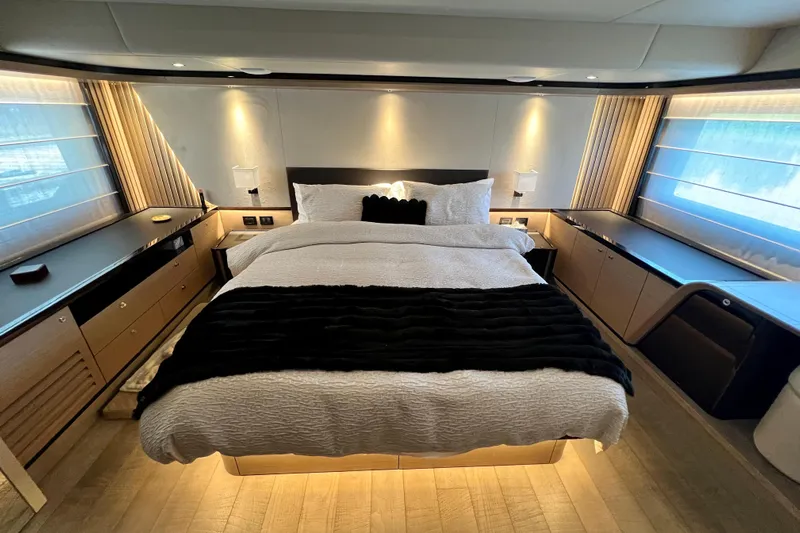  Yacht Photos Pics Luxurious bedroom interior of 2024 Absolute 58 Navetta yacht, featuring elegant design and ambient lighting.