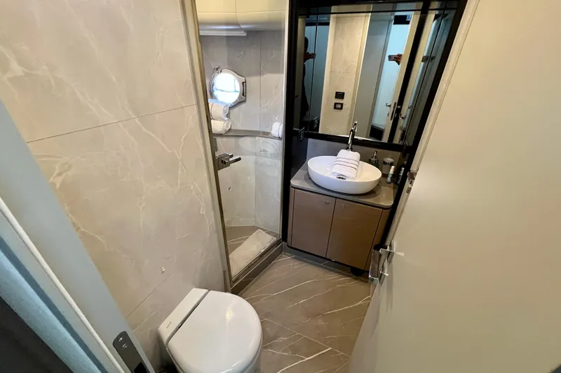  Yacht Photos Pics Luxurious bathroom in 2024 Absolute 58 Navetta yacht with modern fixtures and elegant design.