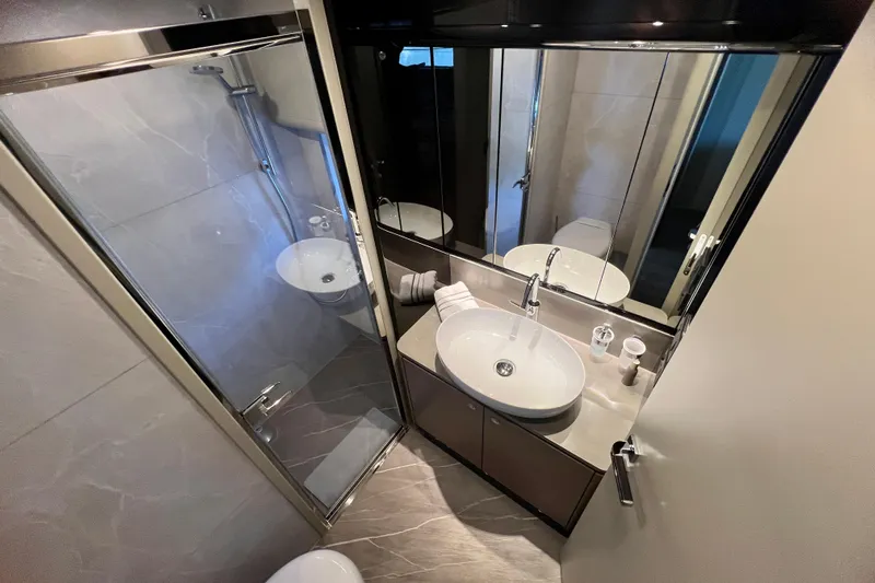  Yacht Photos Pics Luxurious bathroom in 2024 Absolute 58 Navetta yacht with modern fixtures and elegant design.