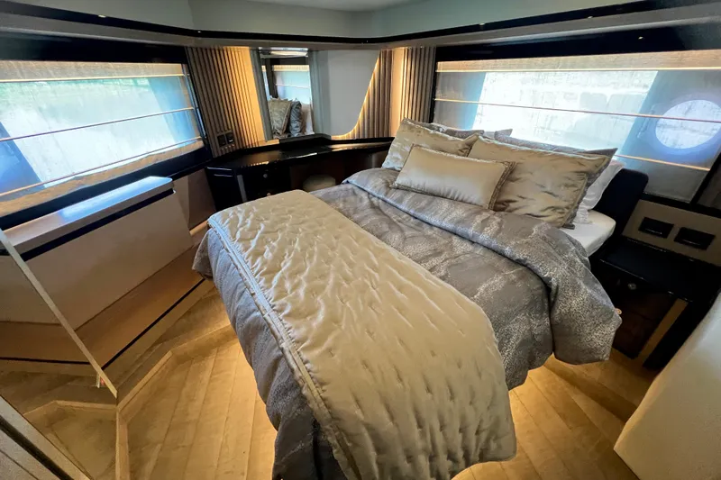  Yacht Photos Pics Luxurious bedroom interior of 2024 Absolute 58 Navetta yacht with elegant bedding and modern design.