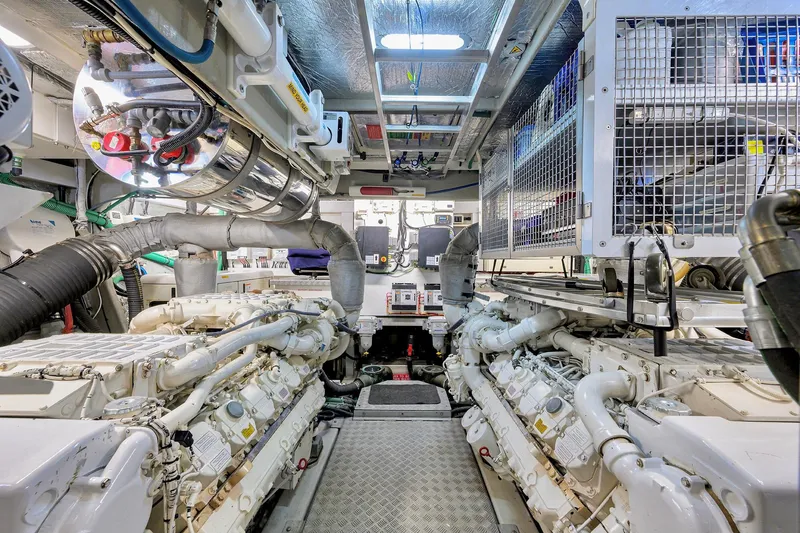  Yacht Photos Pics Engine room of a 2006 Sunseeker 75 Yacht, showcasing dual engines and mechanical systems.