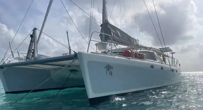 Sv Althea Yacht Photos Pics Leopard 45/47 catamaran sailing on clear waters, 2000 model.