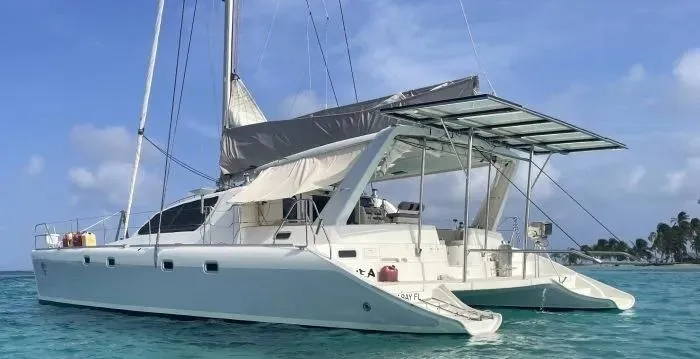 Sv Althea Yacht Photos Pics Leopard 45/47 catamaran sailing in clear blue waters, 2000 model.