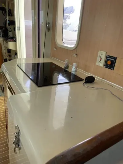 Sv Althea Yacht Photos Pics Leopard 45/47 yacht interior kitchen counter with stove, 2000 model.