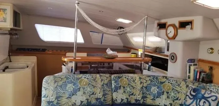 Sv Althea Yacht Photos Pics Interior of 2000 Leopard 45/47 yacht with floral seating and nautical decor.