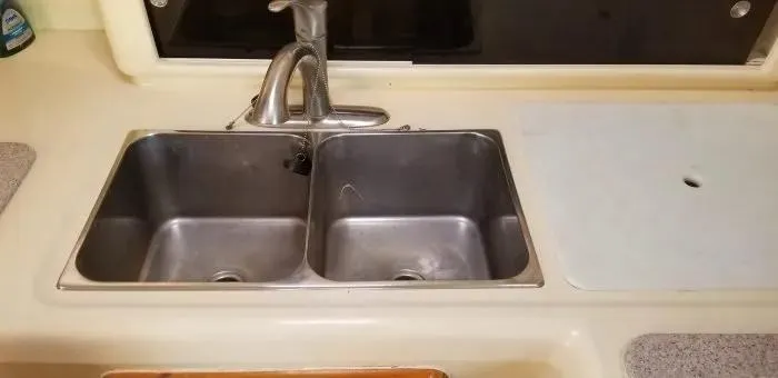 Sv Althea Yacht Photos Pics Stainless steel double sink in Leopard 45/47 yacht kitchen, 2000 model.