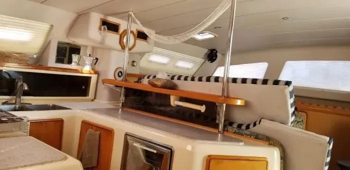 Sv Althea Yacht Photos Pics Interior of 2000 Leopard 45/47 yacht with modern kitchen and seating area.