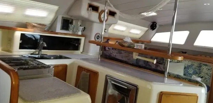 Sv Althea Yacht Photos Pics Interior of a 2000 Leopard 45/47 yacht kitchen with modern amenities.