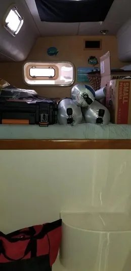 Sv Althea Yacht Photos Pics Interior of a 2000 Leopard 45/47 yacht with storage items and window.