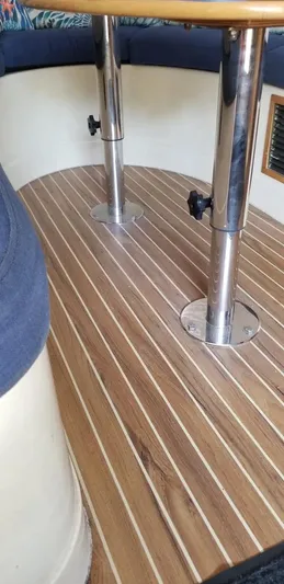 Sv Althea Yacht Photos Pics Leopard 45/47 yacht interior, teak flooring, stainless steel table supports, 2000 model.