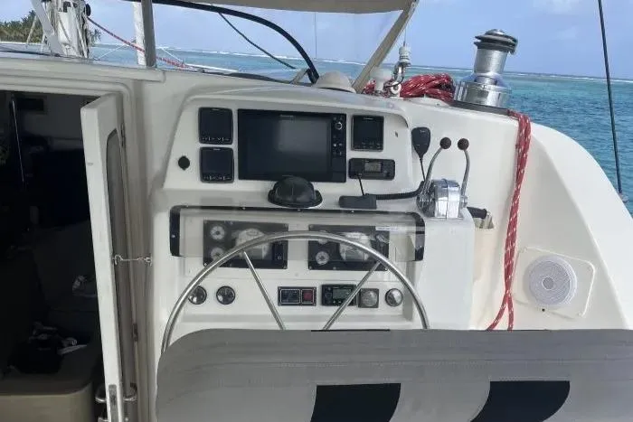 Sv Althea Yacht Photos Pics Leopard 45/47 yacht helm with navigation equipment, steering wheel, and ocean view.
