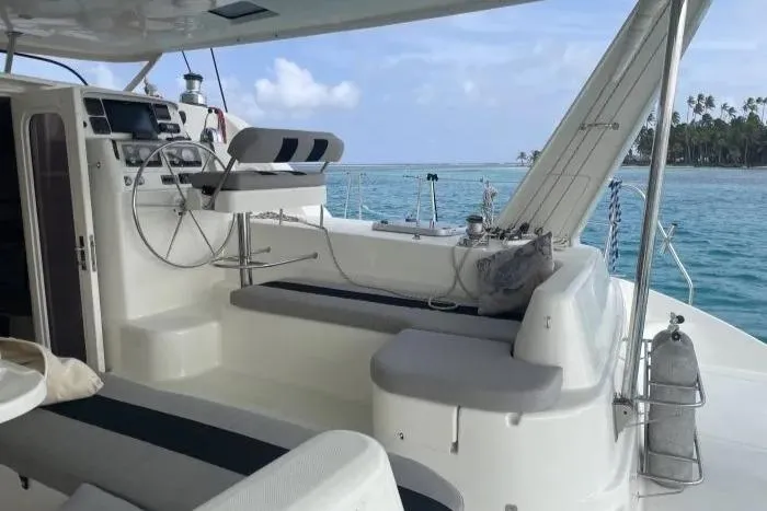 Sv Althea Yacht Photos Pics Leopard 45/47 catamaran cockpit, 2000 model, with ocean view and seating area.