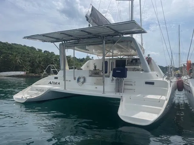 Sv Althea Yacht Photos Pics Leopard 45/47 catamaran, 2000 model, docked in tropical marina setting.