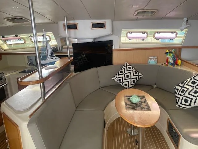 Sv Althea Yacht Photos Pics Spacious Leopard 45/47 yacht interior with cozy seating and modern decor, year 2000 model.