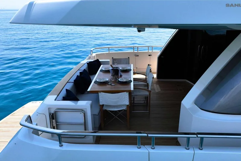 Aman - Sanlorenzo Sl96 Yacht Photos Pics Luxury dining area on 2016 Sanlorenzo SL96 yacht, overlooking serene ocean waters.