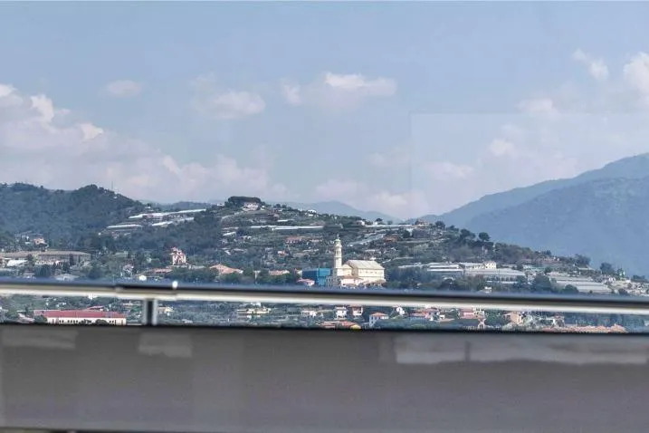 Aman - Sanlorenzo Sl96 Yacht Photos Pics View from Sanlorenzo SL96 yacht, 2016, overlooking scenic hillside and distant mountains.