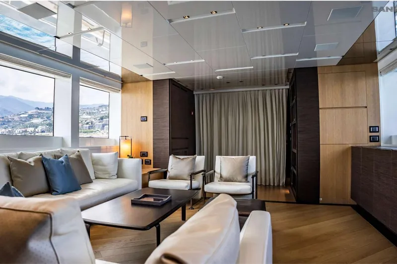 Aman - Sanlorenzo Sl96 Yacht Photos Pics Luxurious interior of 2016 Sanlorenzo SL96 yacht with elegant seating and scenic windows.