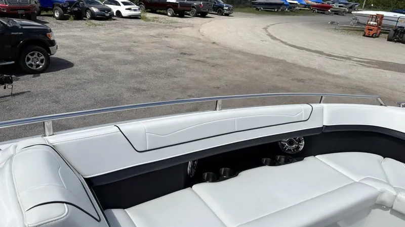  Yacht Photos Pics 2022 Formula 350 CBR boat with white seating and cup holders, parked in a lot.